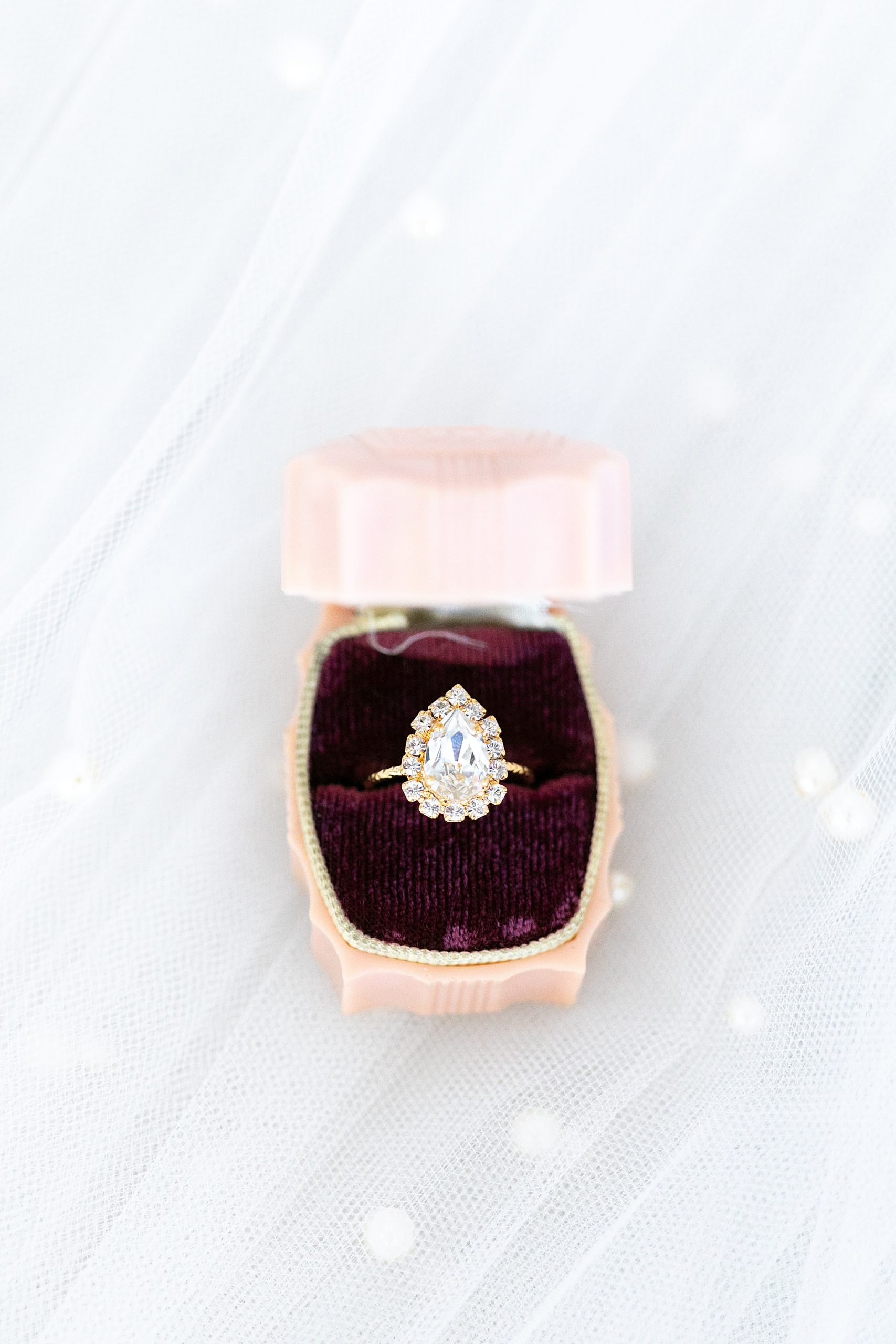 wedding ring in pastel pink box