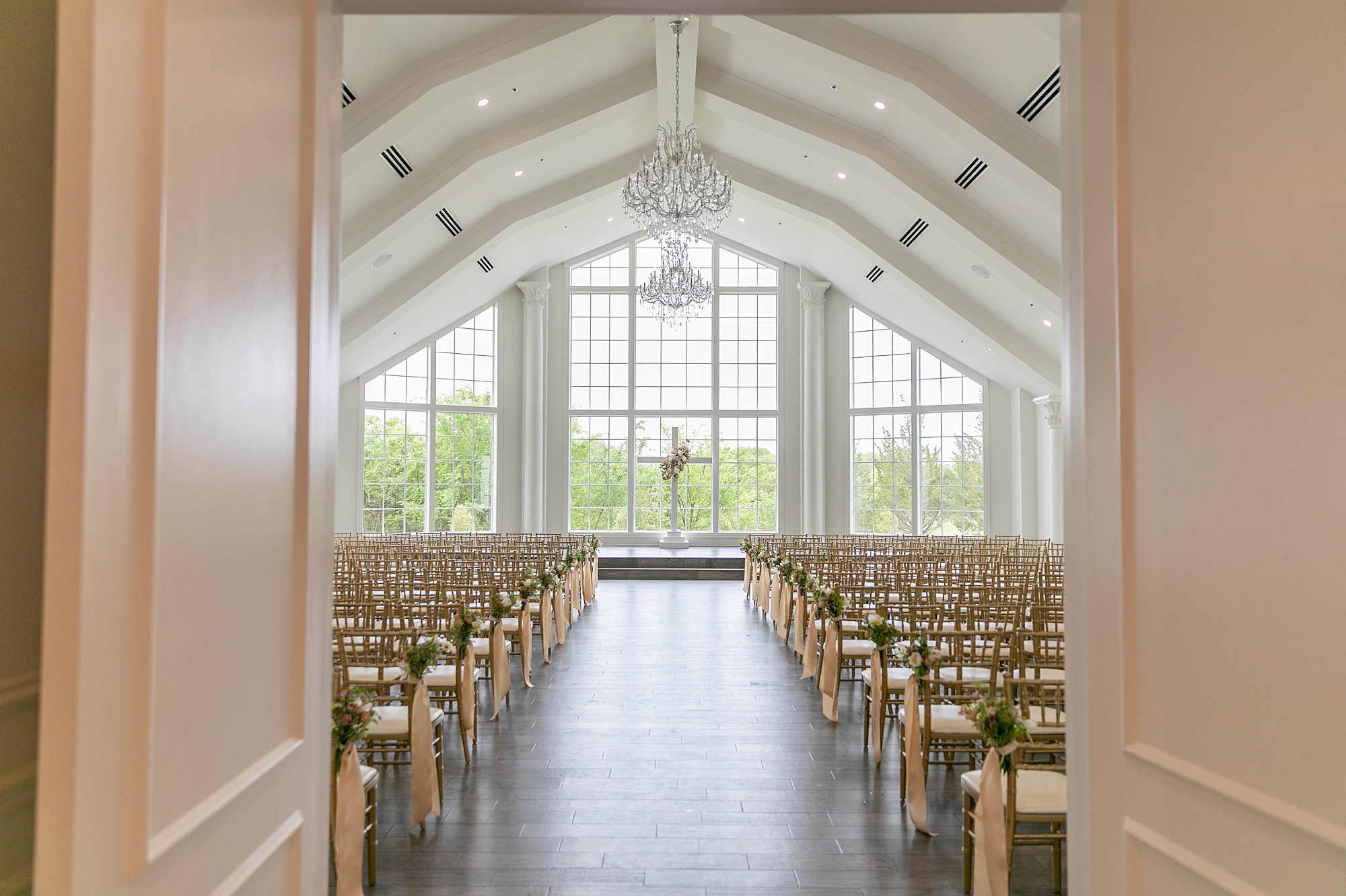 chapel inside the Hillside Estate with white cross and muted spring flowers 