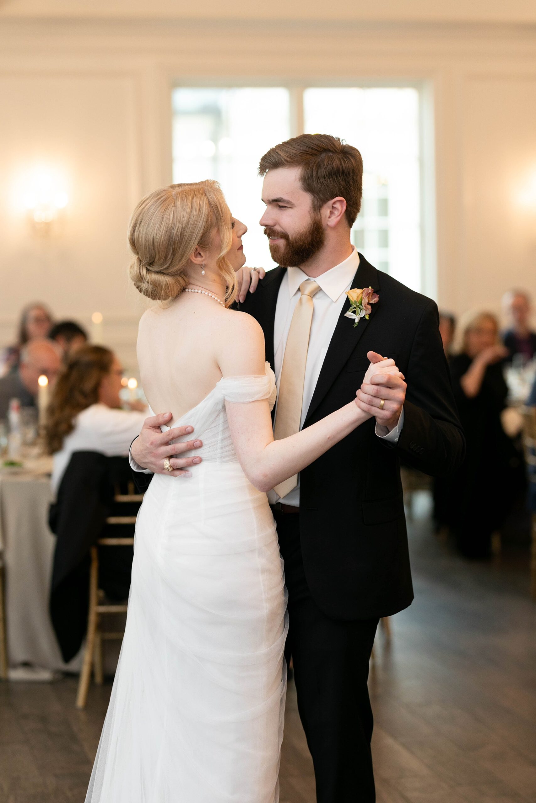bride and groom dance together during Denton TX wedding reception