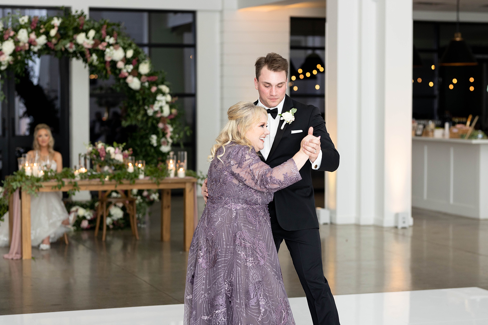 groom and mother dance during Dallas TX wedding reception