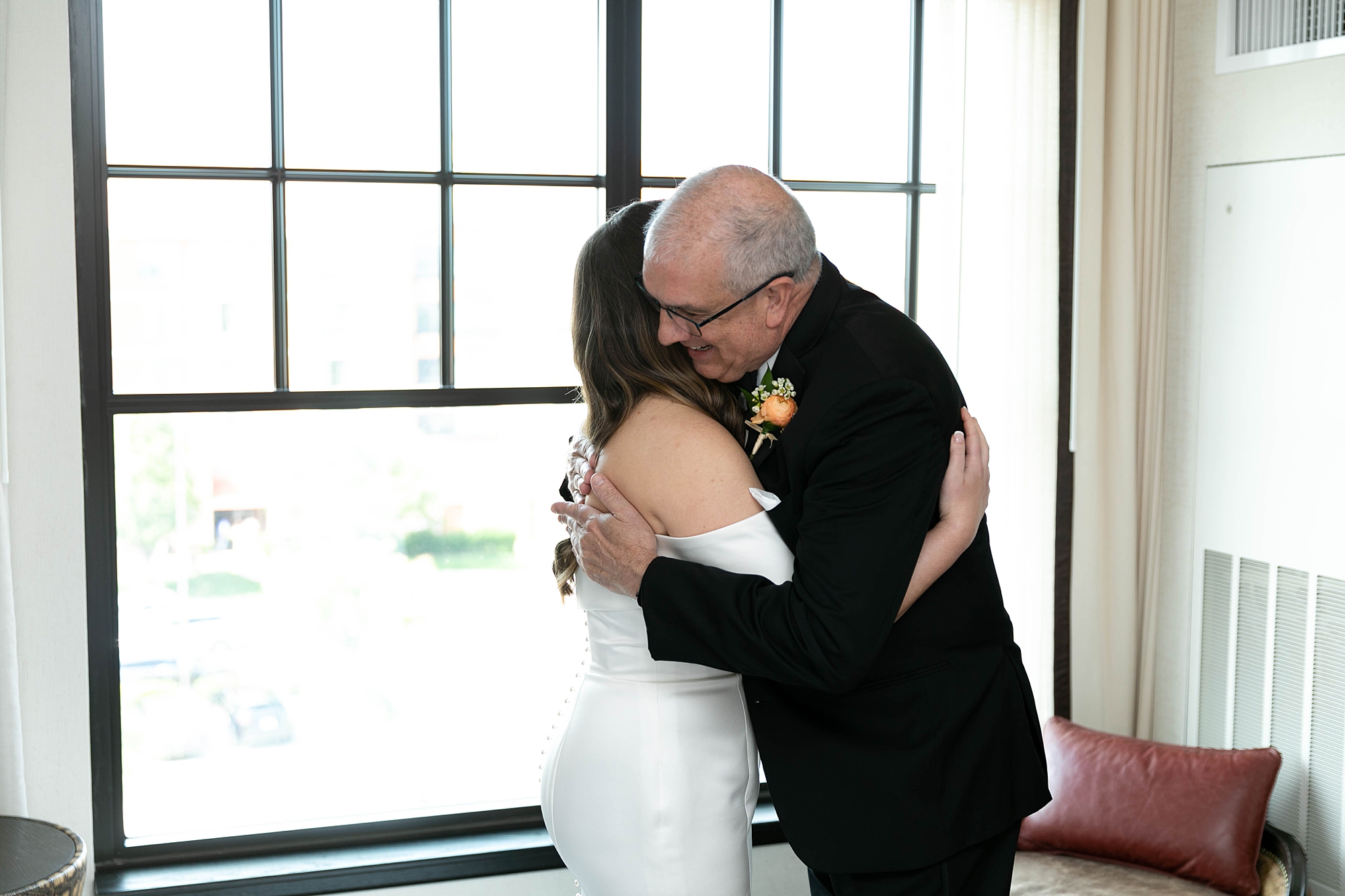 bride hugs father during first look at the Hotel Drover