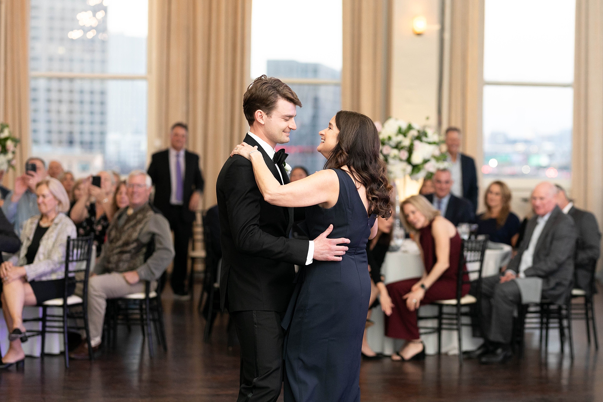 bride and mother dance together during wedding reception at the Room on Main
