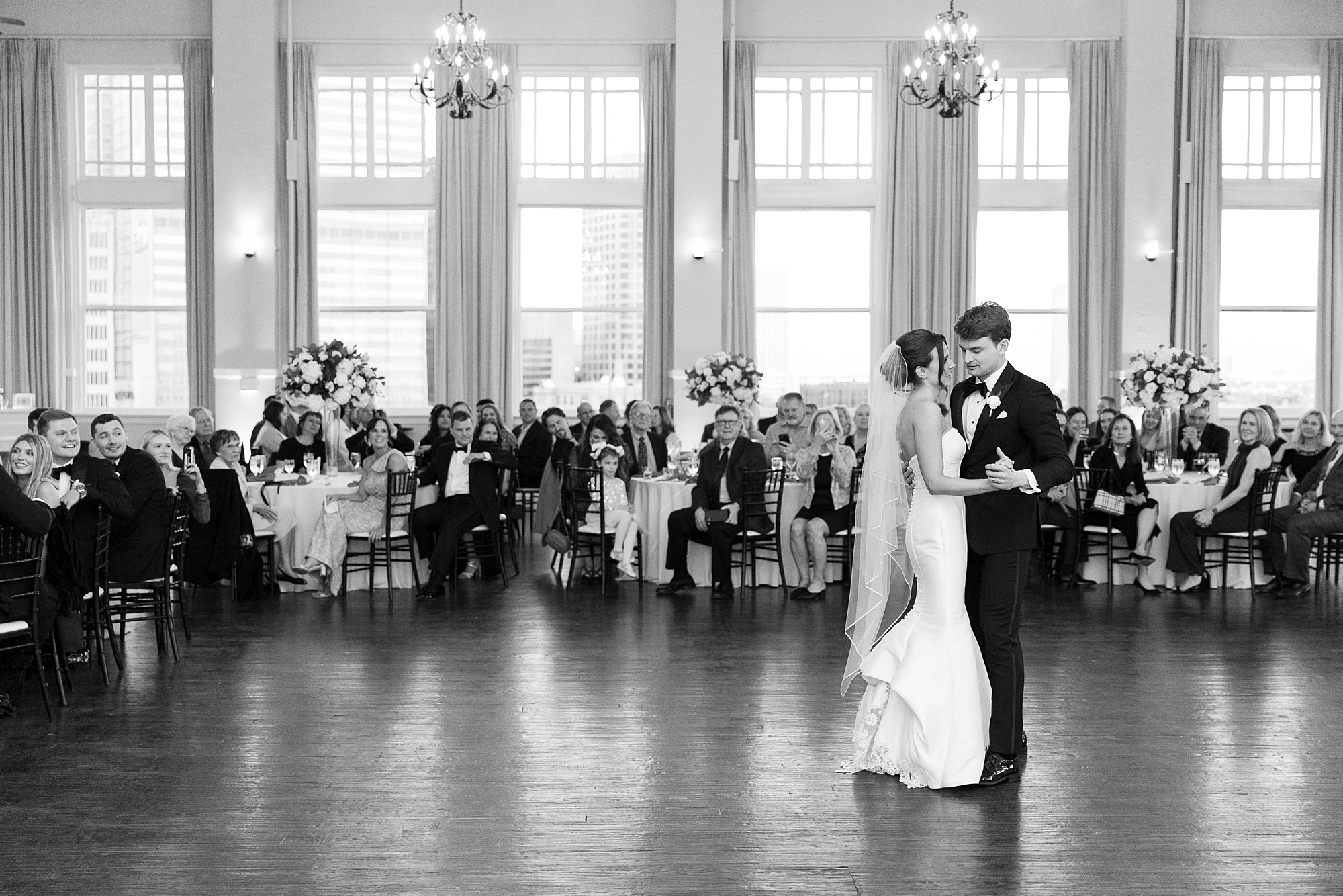 bride and groom dance during wedding reception at the Room on Main