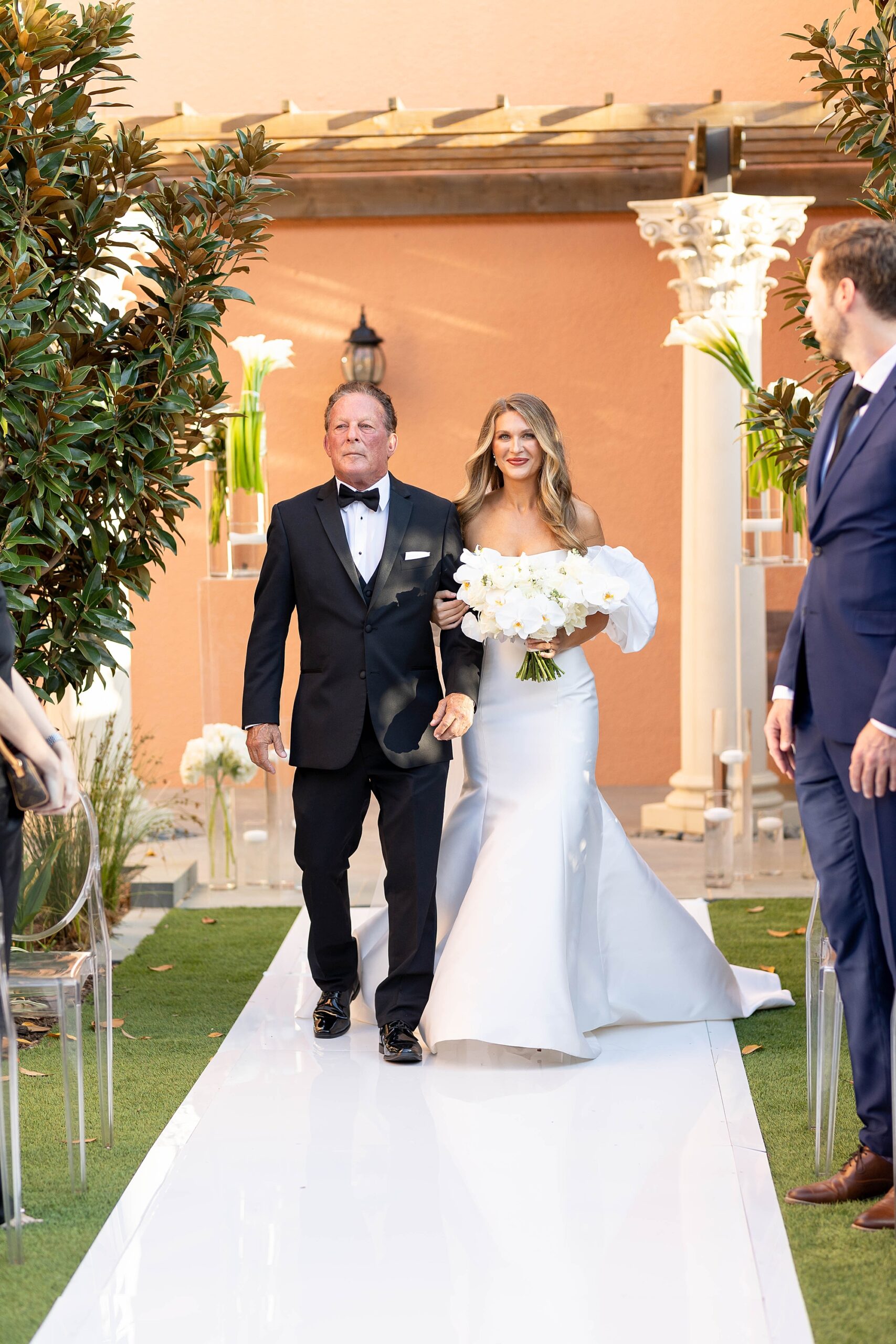 bride and father walk down aisle for ceremony at Rosewood Mansion