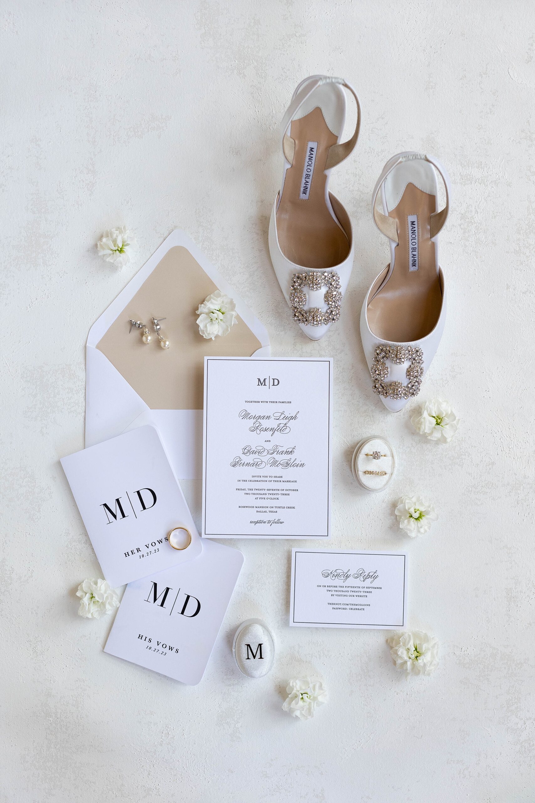 invitation suite with custom vow booklets and bride's white shoes 