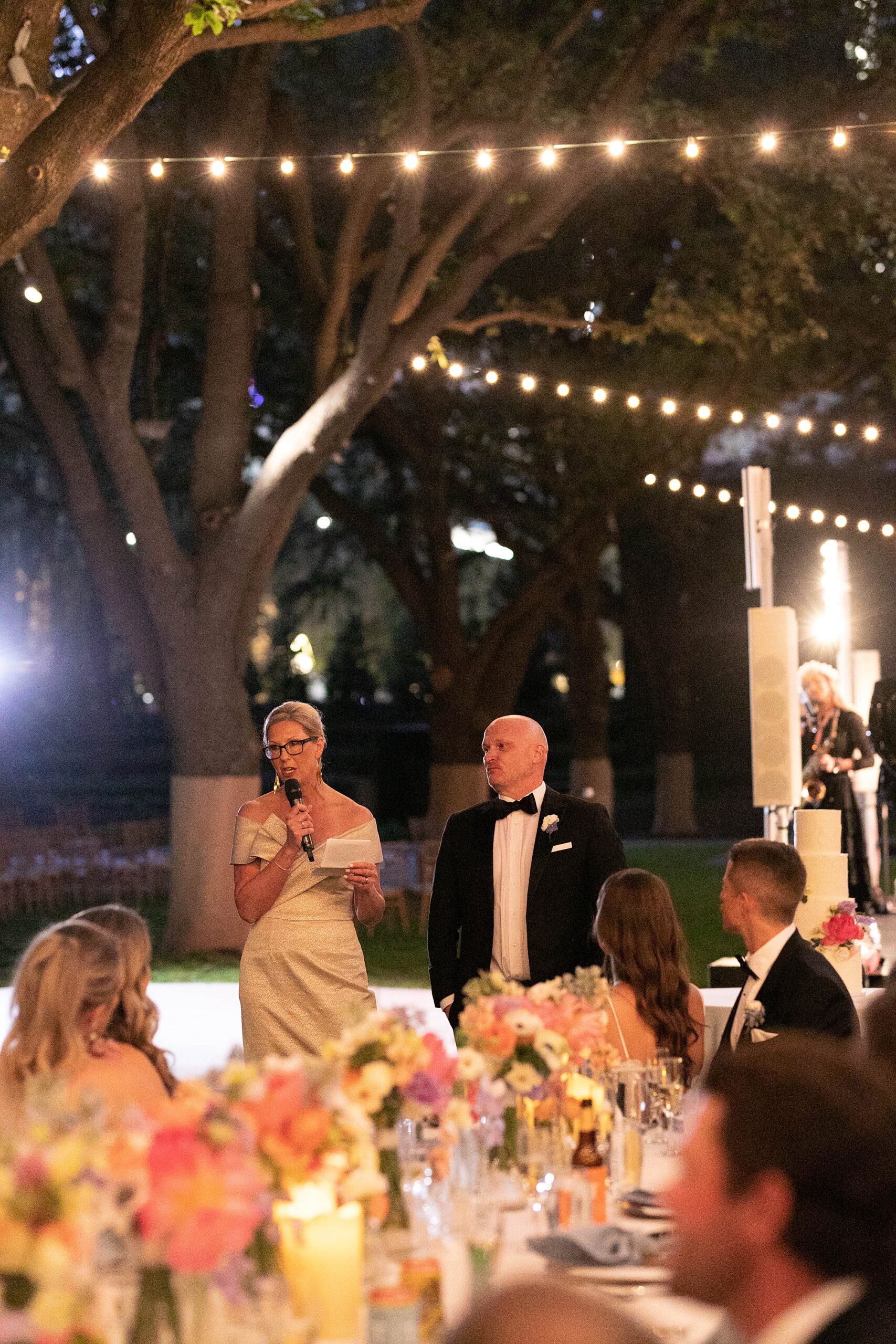 parents give speech to newlyweds during al fresco wedding reception at the Nasher Sculpture Center