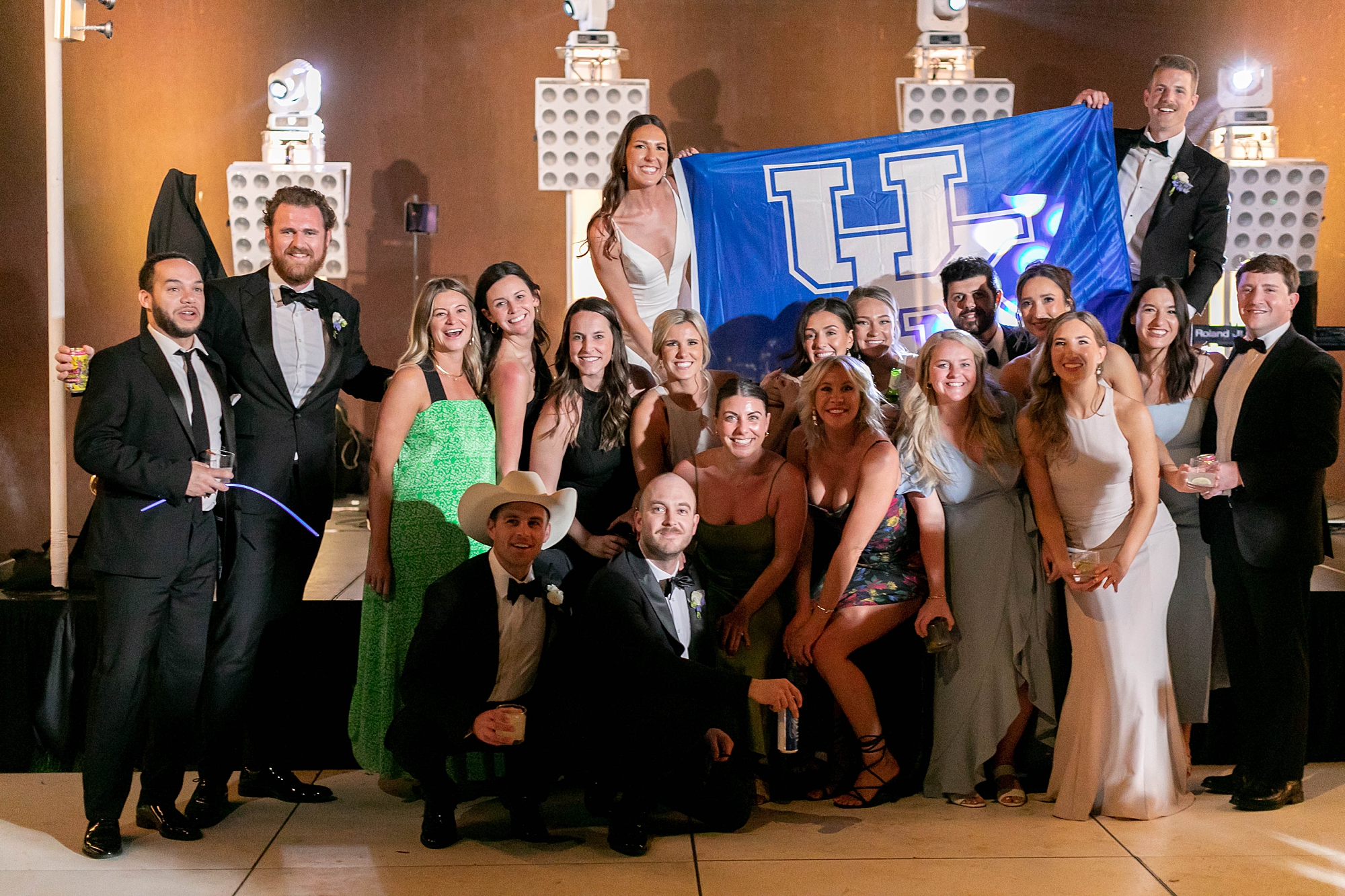 newlyweds pose with classmates from University of Kentucky 