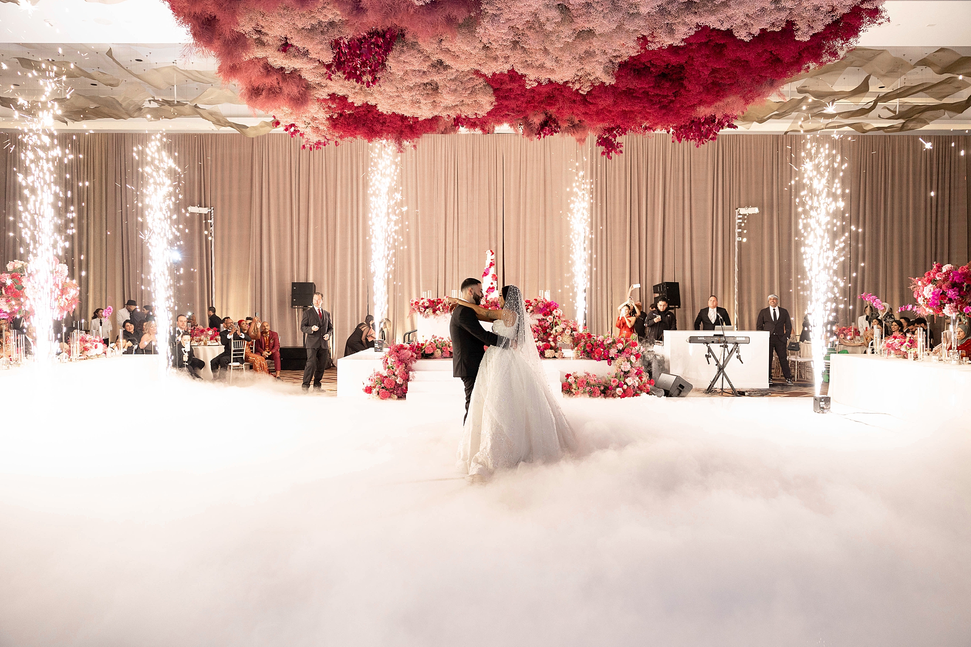bride and groom dance in fog at the Omni Frisco at the Star reception 