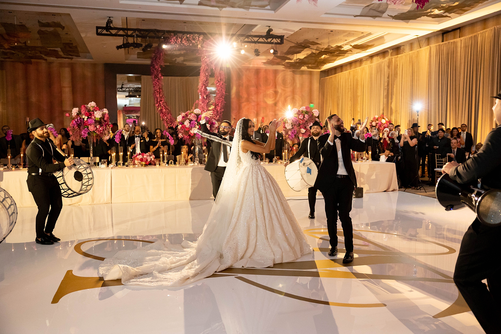 newlyweds dance with Palestinian band on dance floor