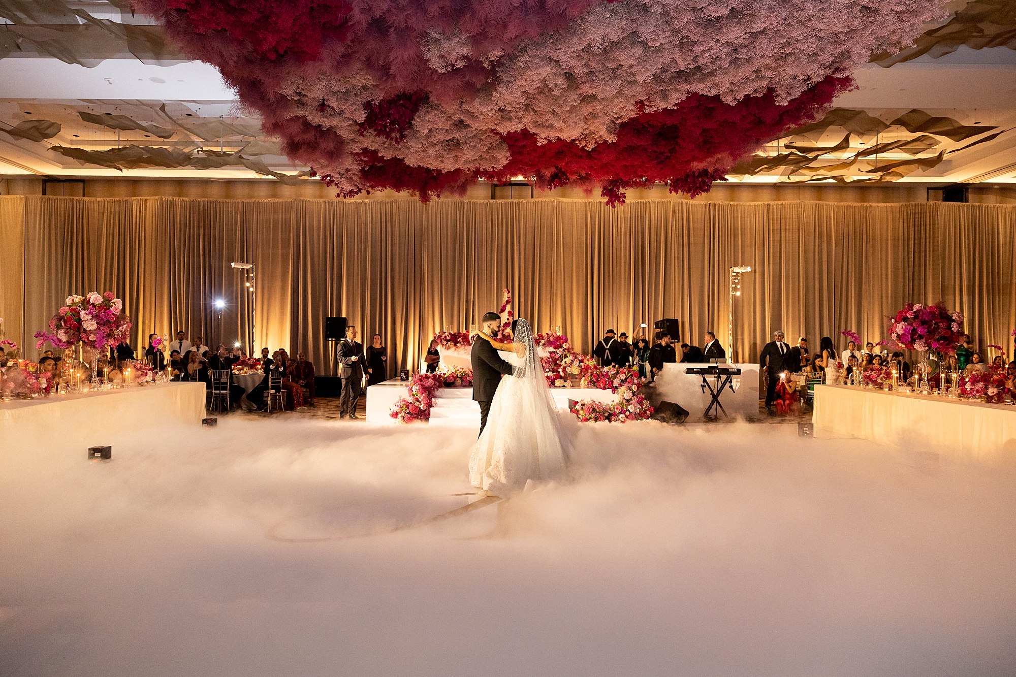 newlyweds dance in fog on dance floor at the Omni Frisco at the Star