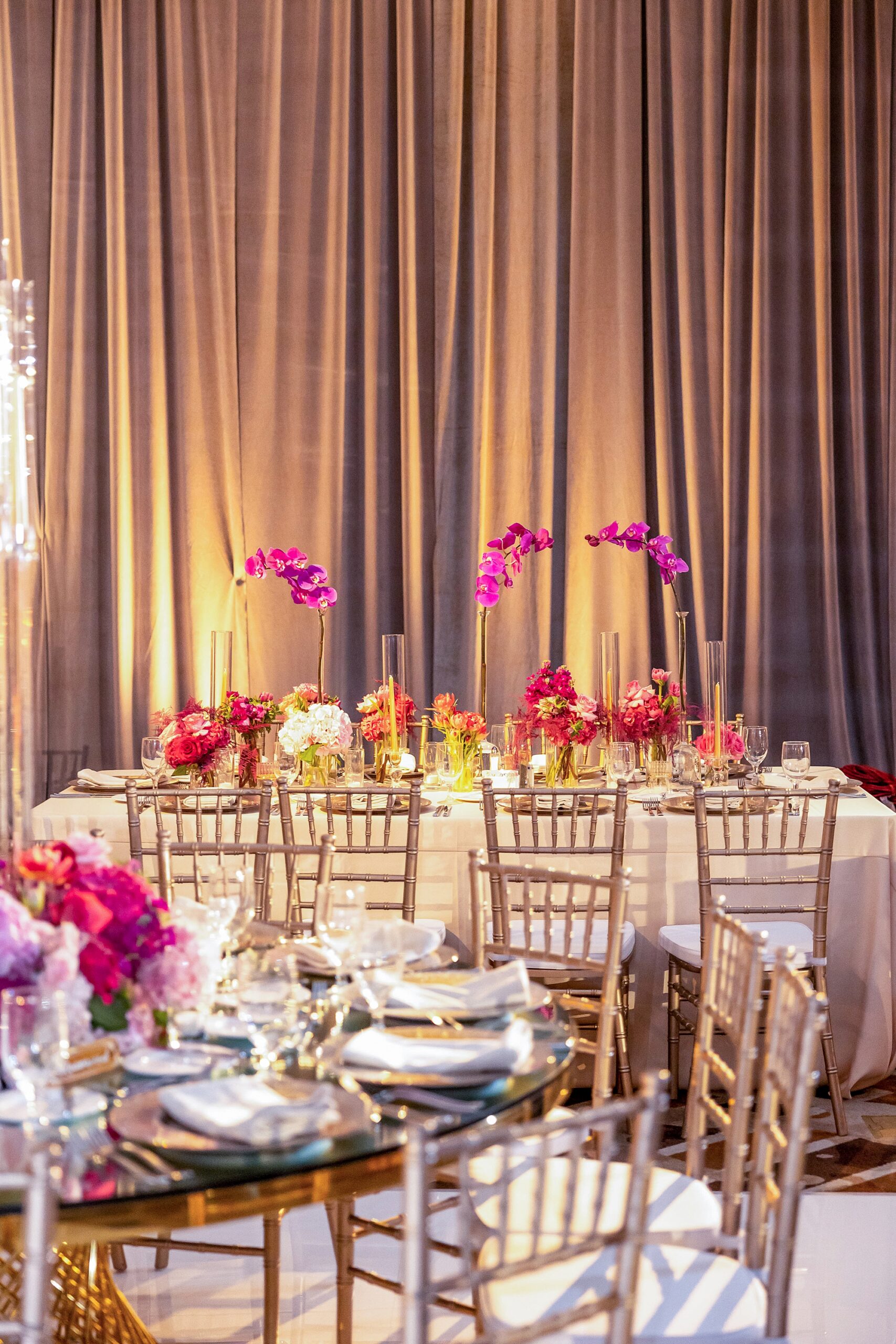 wedding reception at the Omni Frisco at the Star with bright pink and gold accents 